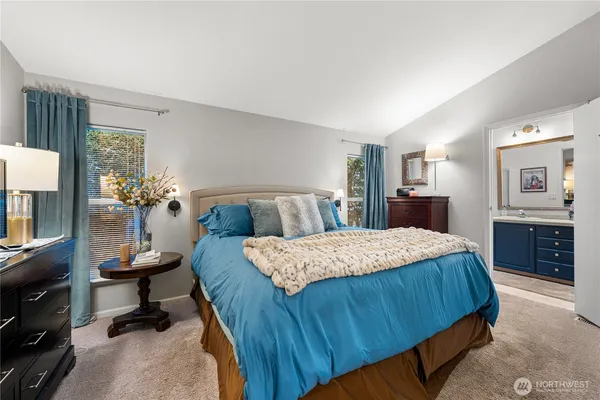 a bedroom with a bed and dresser
