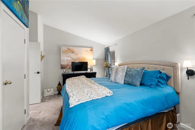 a bedroom with a bed and a view of bathroom