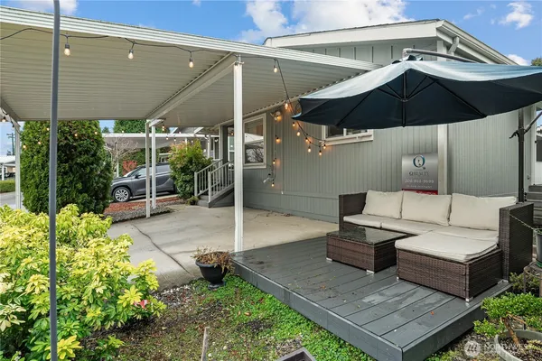 a patio with table and chairs