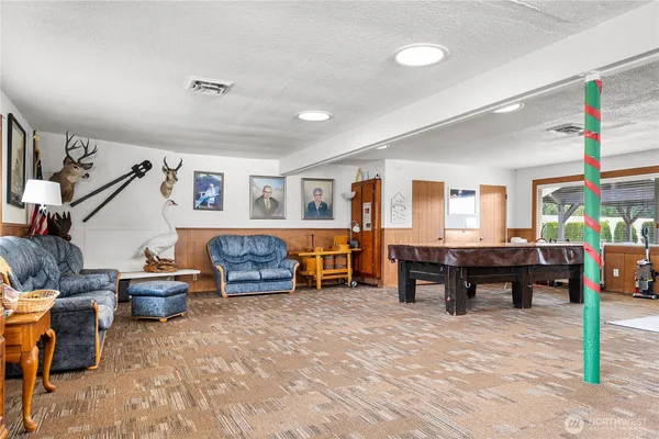 a bedroom with furniture and a lamp