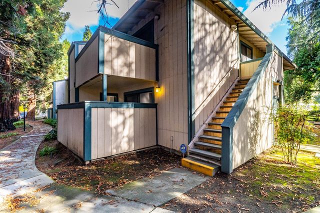 a view of a house with a small yard