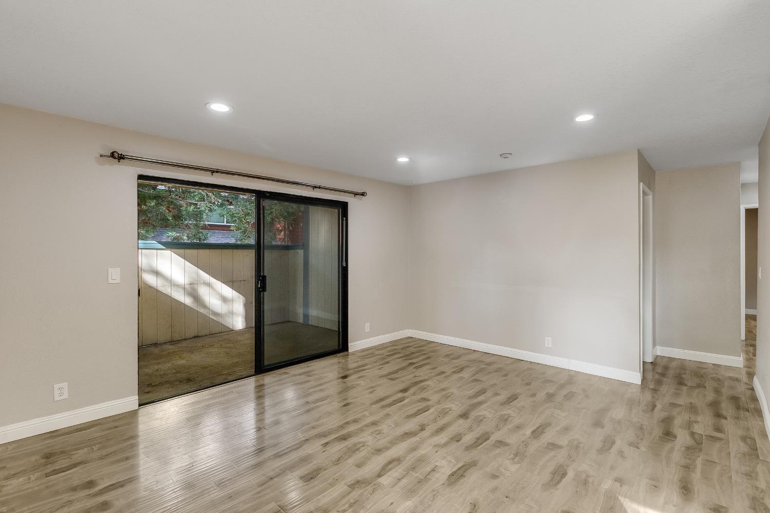 2623 Copa Del Oro Drive Union City, CA 94587 - Photo 15 of 55 a view of an empty room with wooden floor and a window