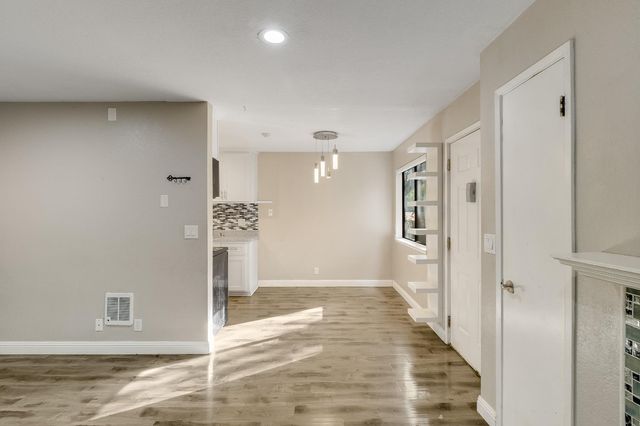 a kitchen with stainless steel appliances a stove a sink and a refrigerator