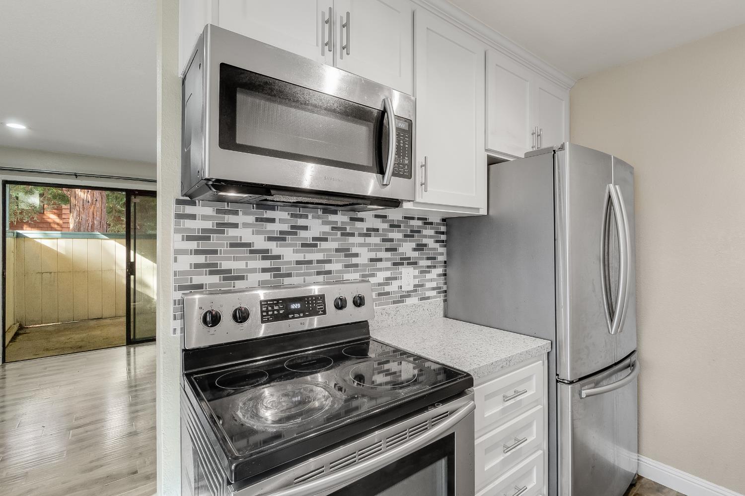 2623 Copa Del Oro Drive Union City, CA 94587 - Photo 27 of 55 a kitchen with stainless steel appliances granite countertop a stove microwave and refrigerator