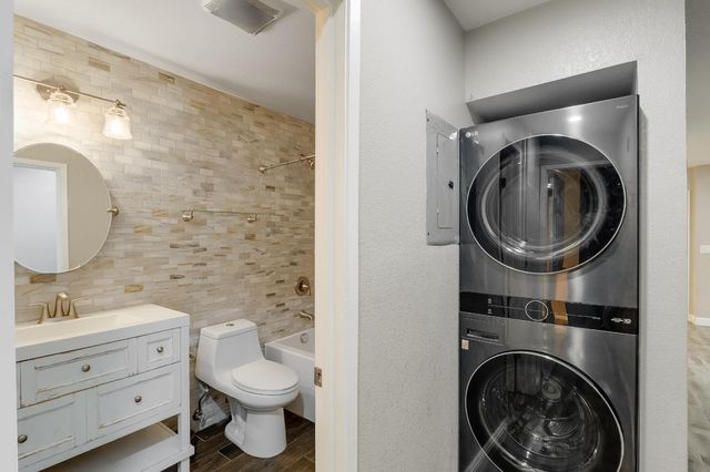 a view of hallway with wooden floor