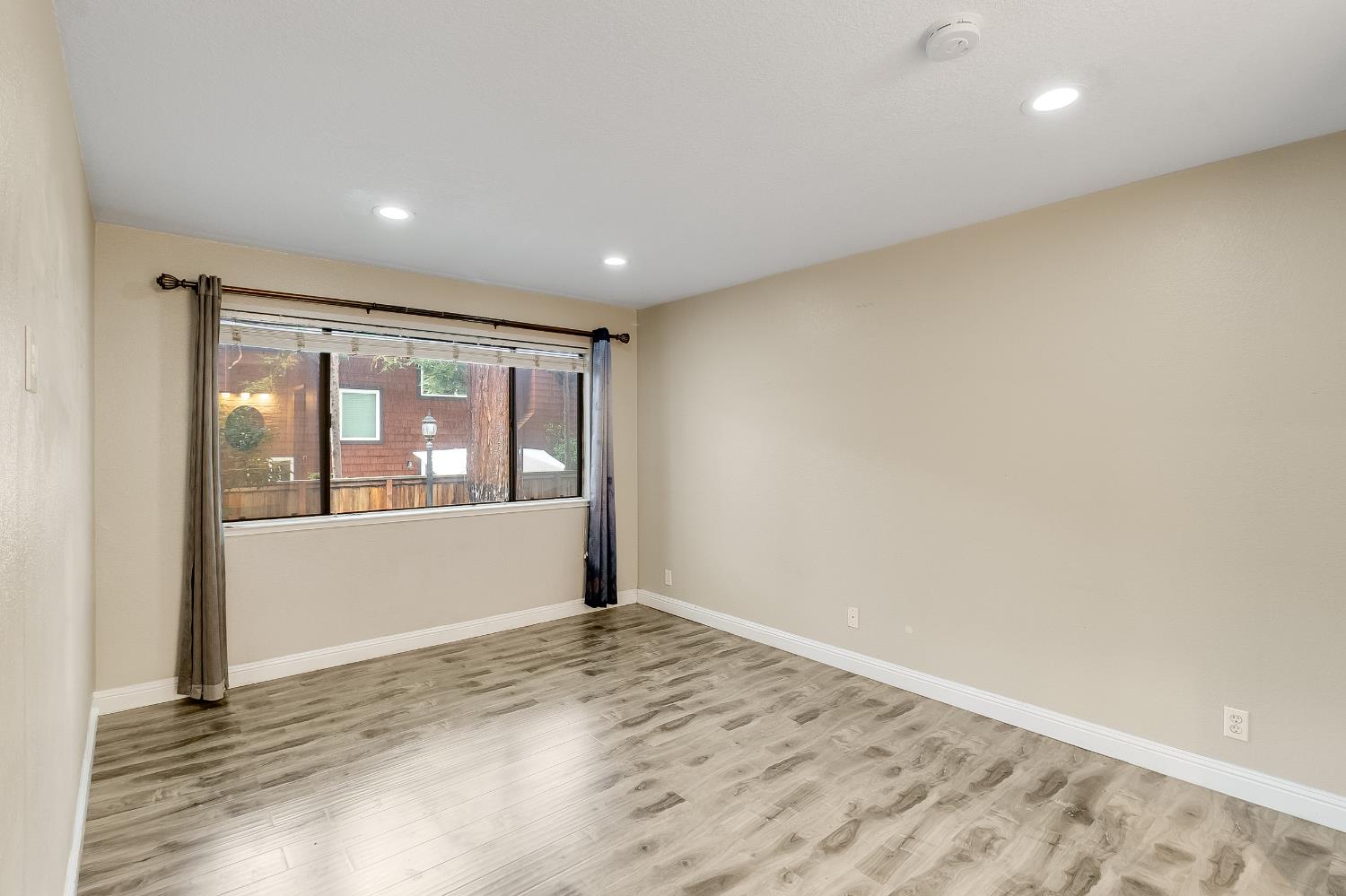 2623 Copa Del Oro Drive Union City, CA 94587 - Photo 39 of 55 an empty room with wooden floor and windows