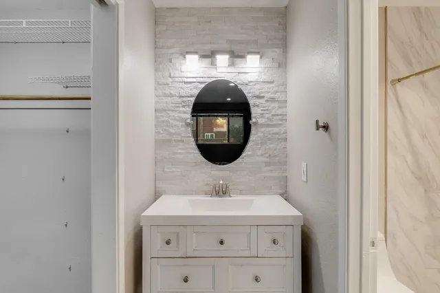 a workspace with furniture and a potted plant
