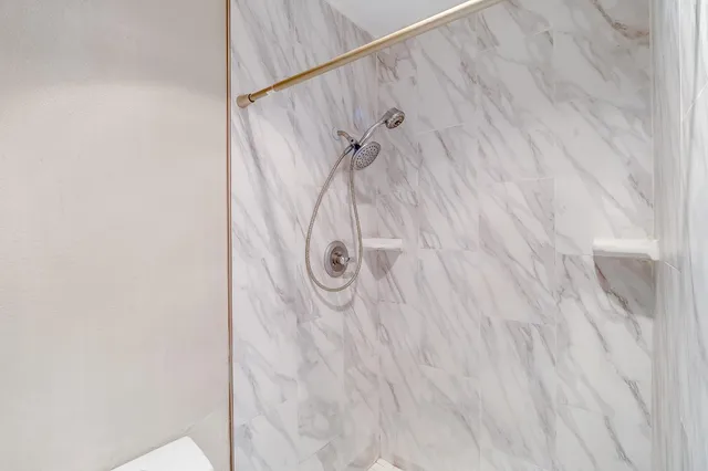 an empty room with mirror in closet