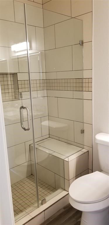 830 Threadneedle Street, Unit 228 Houston, TX 77079 - Photo 9 of 9 a bathroom with a toilet and a shower