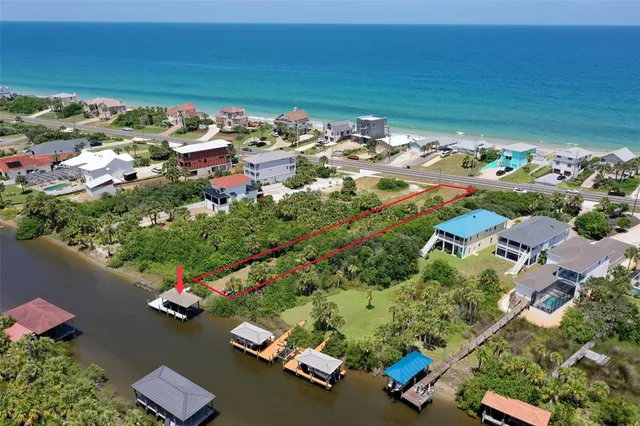 an aerial view of a houses with outdoor space