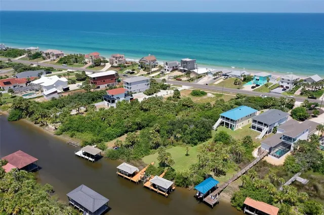 an aerial view of a residential houses with outdoor space