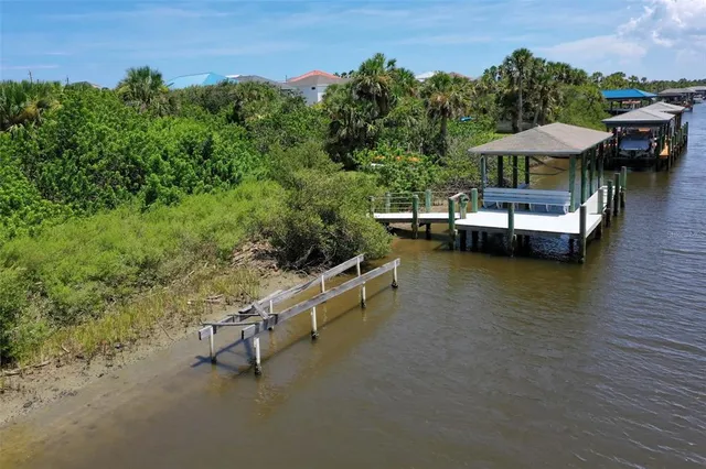 a view of a lake with a lounge chair