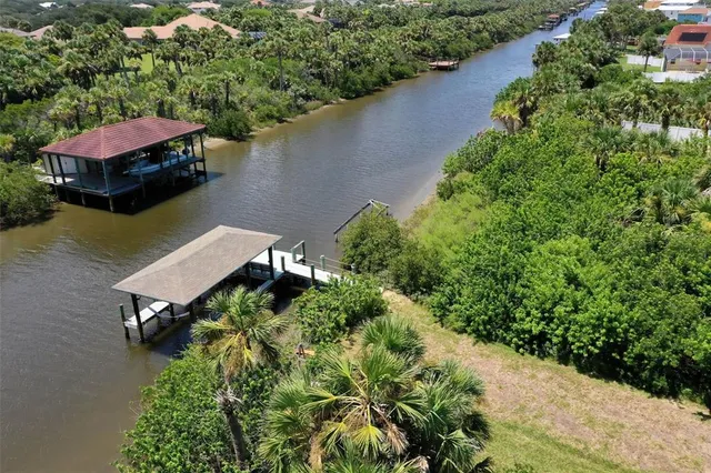 an aerial view of a house with lake view
