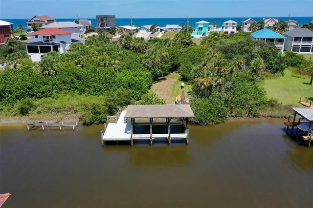 an outdoor space with swimming pool and furniture