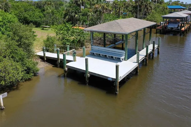 a view of a patio with chairs and a table