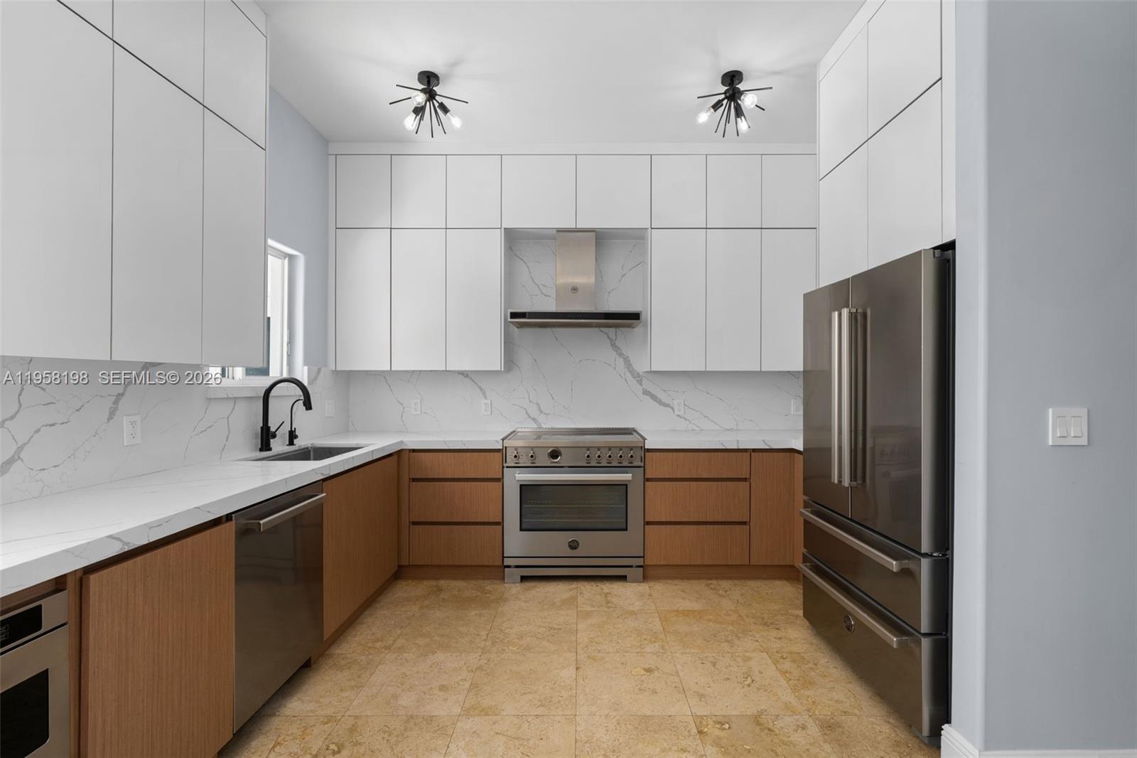 16800 Southwest 190th Street Miami, FL 33187 - Photo 14 of 56 a kitchen with stainless steel appliances granite countertop a refrigerator and a sink