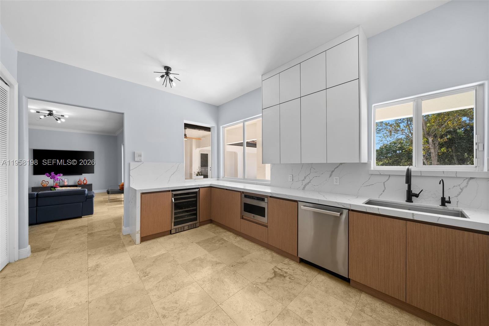 16800 Southwest 190th Street Miami, FL 33187 - Photo 16 of 56 a large kitchen with stainless steel appliances granite countertop a sink and cabinets