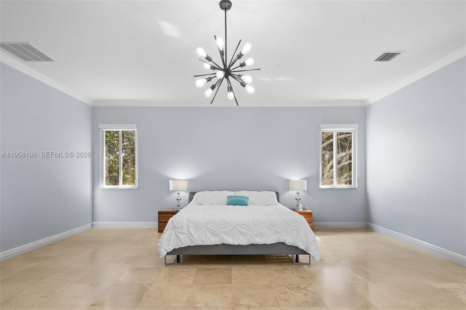 16800 Southwest 190th Street Miami, FL 33187 - Photo 19 of 56 a bedroom with a bed and window