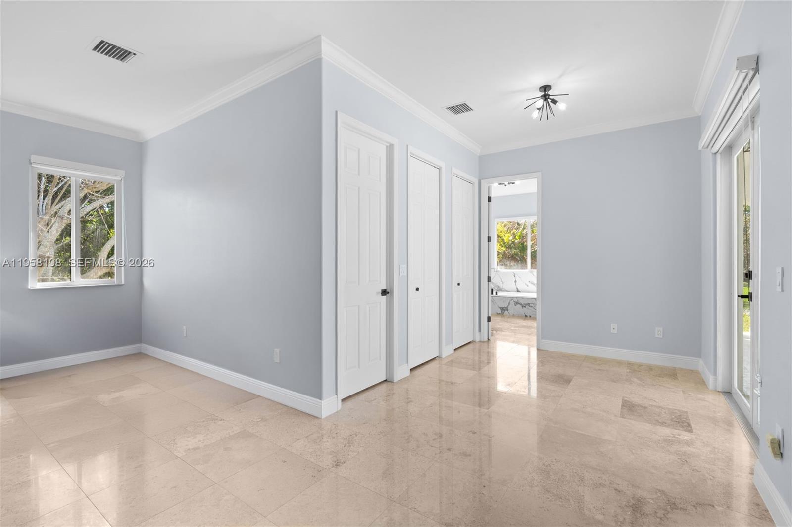 16800 Southwest 190th Street Miami, FL 33187 - Photo 20 of 56 a view of an empty room with closet and a window