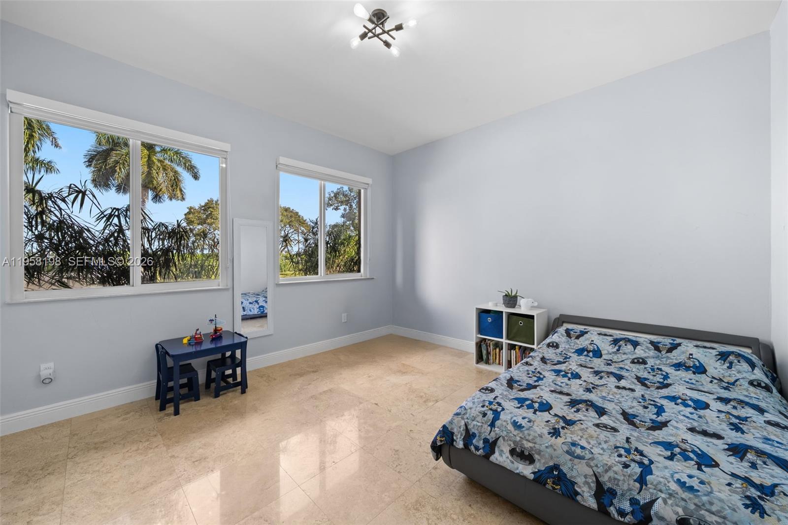 16800 Southwest 190th Street Miami, FL 33187 - Photo 24 of 56 a bedroom with a bed and a painting on the wall