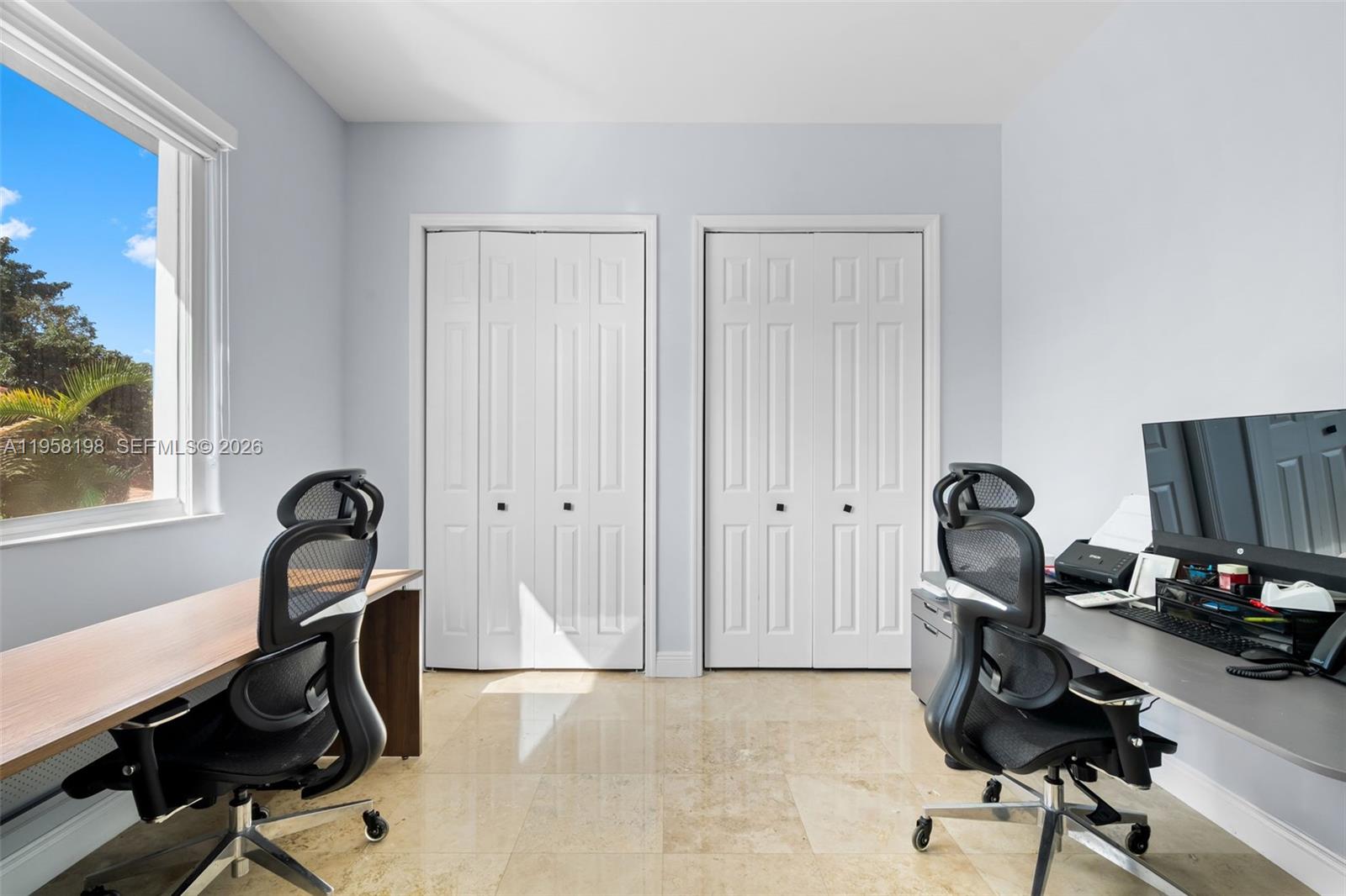 16800 Southwest 190th Street Miami, FL 33187 - Photo 28 of 56 a view of a workspace with furniture and gym equipment