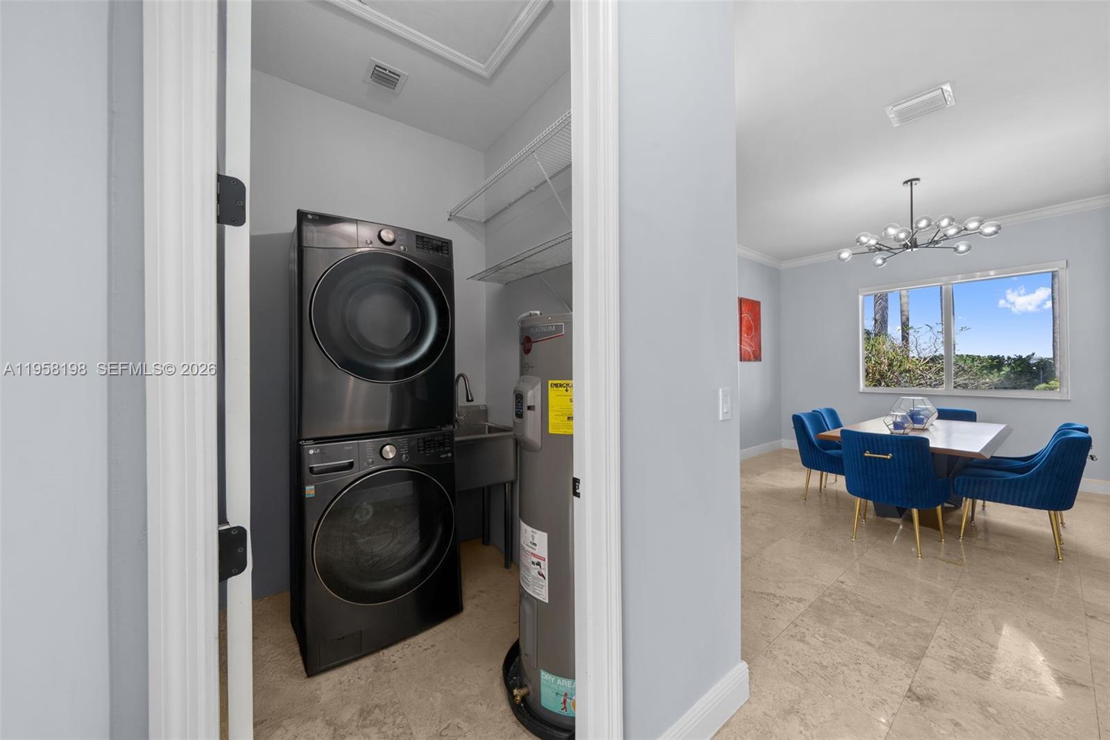 16800 Southwest 190th Street Miami, FL 33187 - Photo 30 of 56 a view of a hallway with washer and dryer