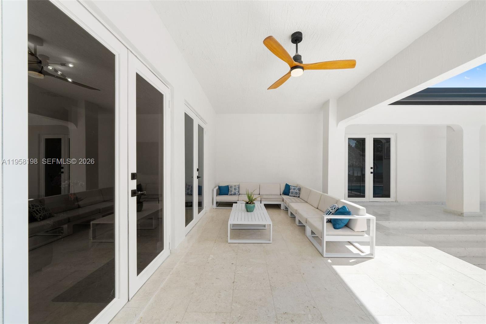 16800 Southwest 190th Street Miami, FL 33187 - Photo 32 of 56 a living room with furniture and a ceiling fan