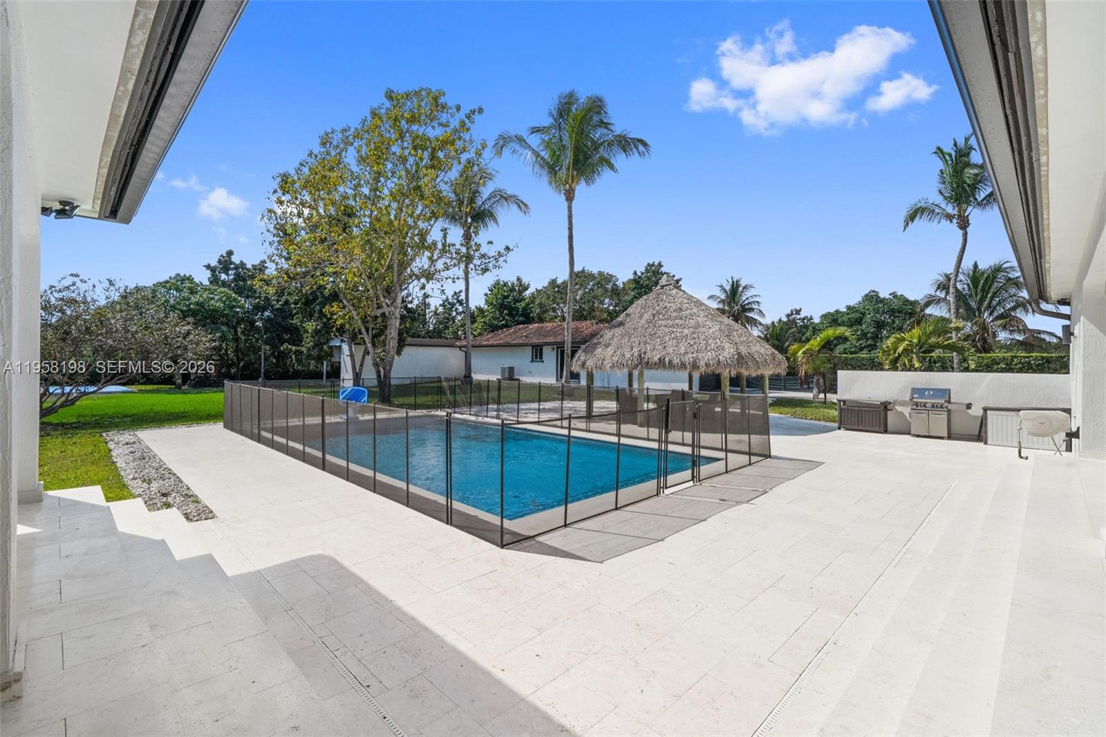 16800 Southwest 190th Street Miami, FL 33187 - Photo 34 of 56 a view of a swimming pool with a patio