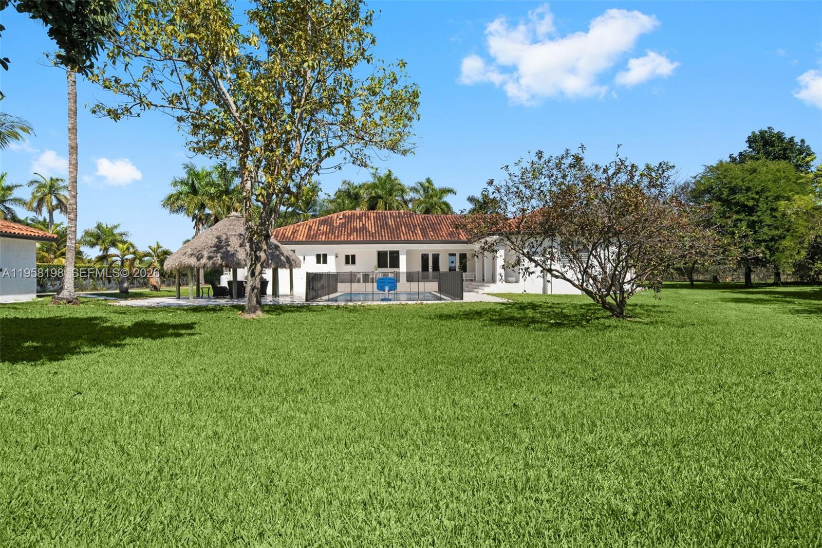 16800 Southwest 190th Street Miami, FL 33187 - Photo 44 of 56 a view of a house with a big yard
