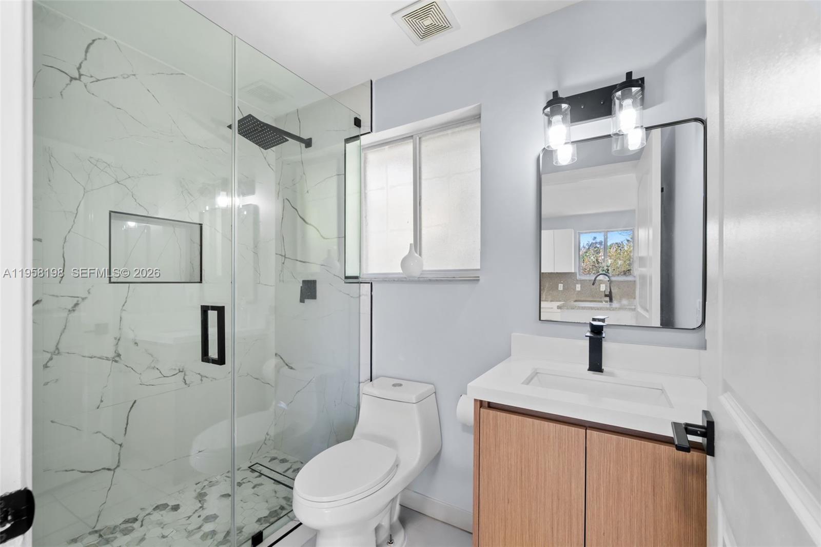 16800 Southwest 190th Street Miami, FL 33187 - Photo 50 of 56 a bathroom with a toilet sink and shower