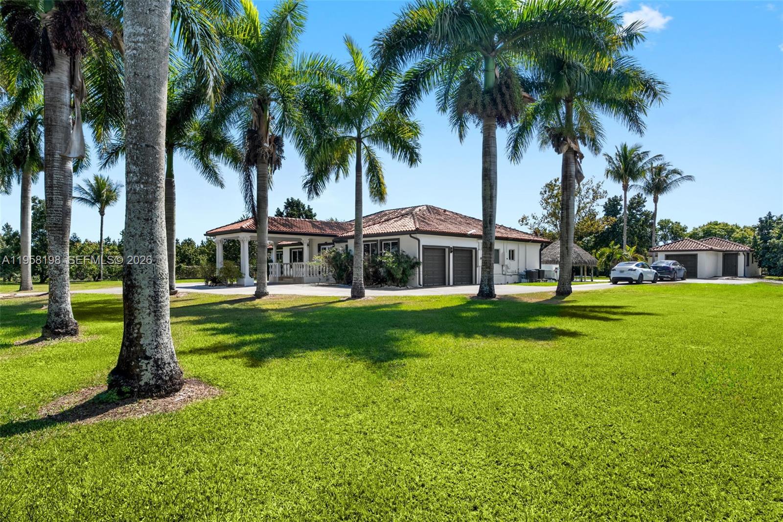 16800 Southwest 190th Street Miami, FL 33187 - Photo 5 of 56 a view of a house with a swimming pool