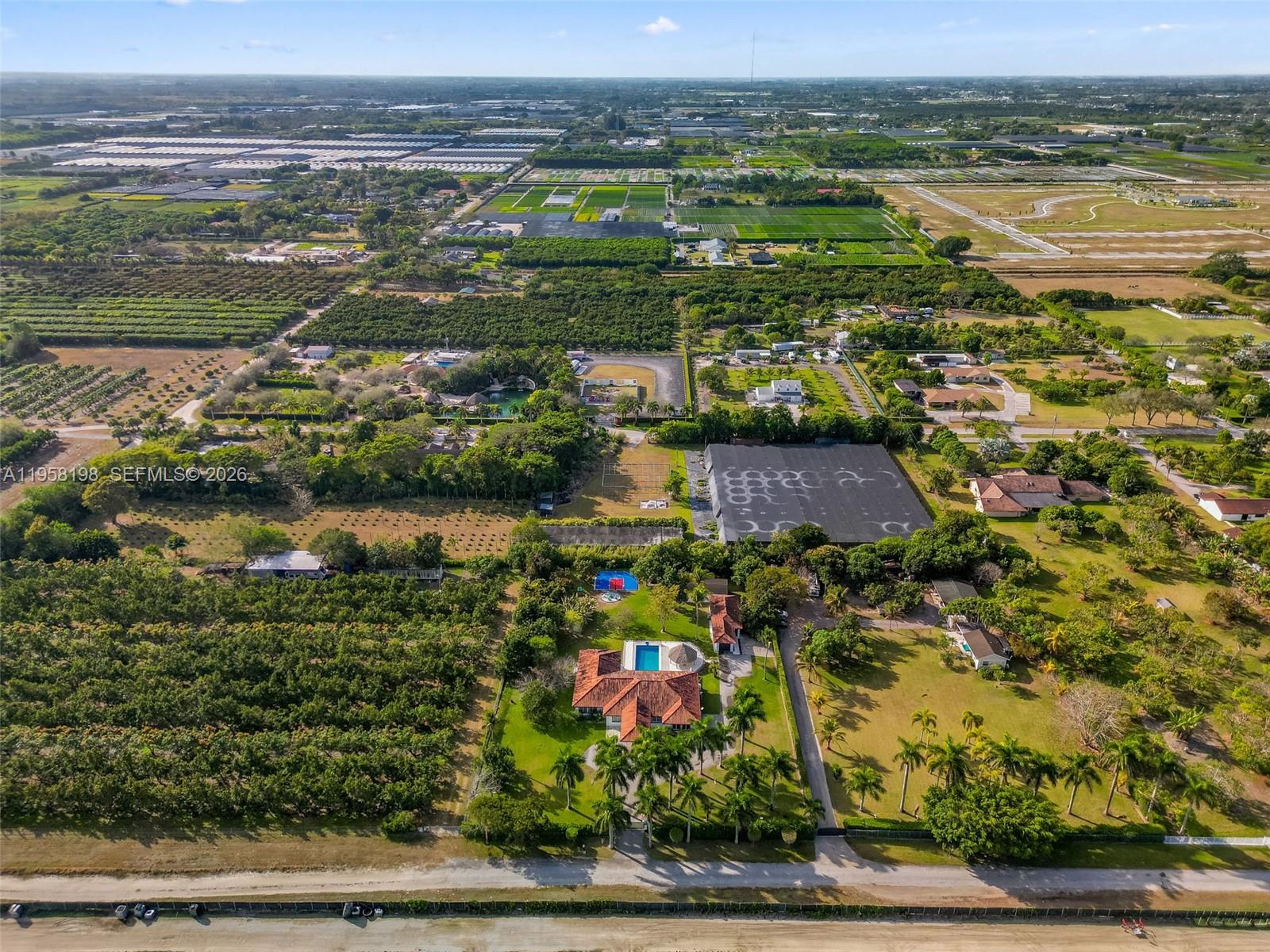 16800 Southwest 190th Street Miami, FL 33187 - Photo 56 of 56 an aerial view of residential houses with outdoor space and lake view