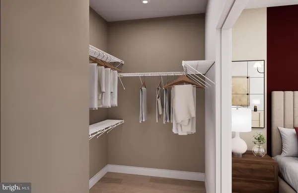 a bathroom with a granite countertop toilet sink and mirror