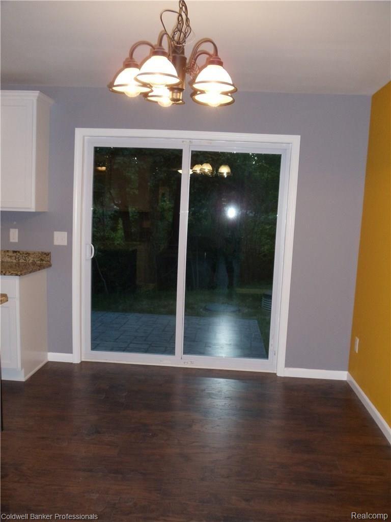 4711 Duck Lake Road North Highland, MI 48356 - Photo 10 of 29 Formal dining room with a door wall to the patio.