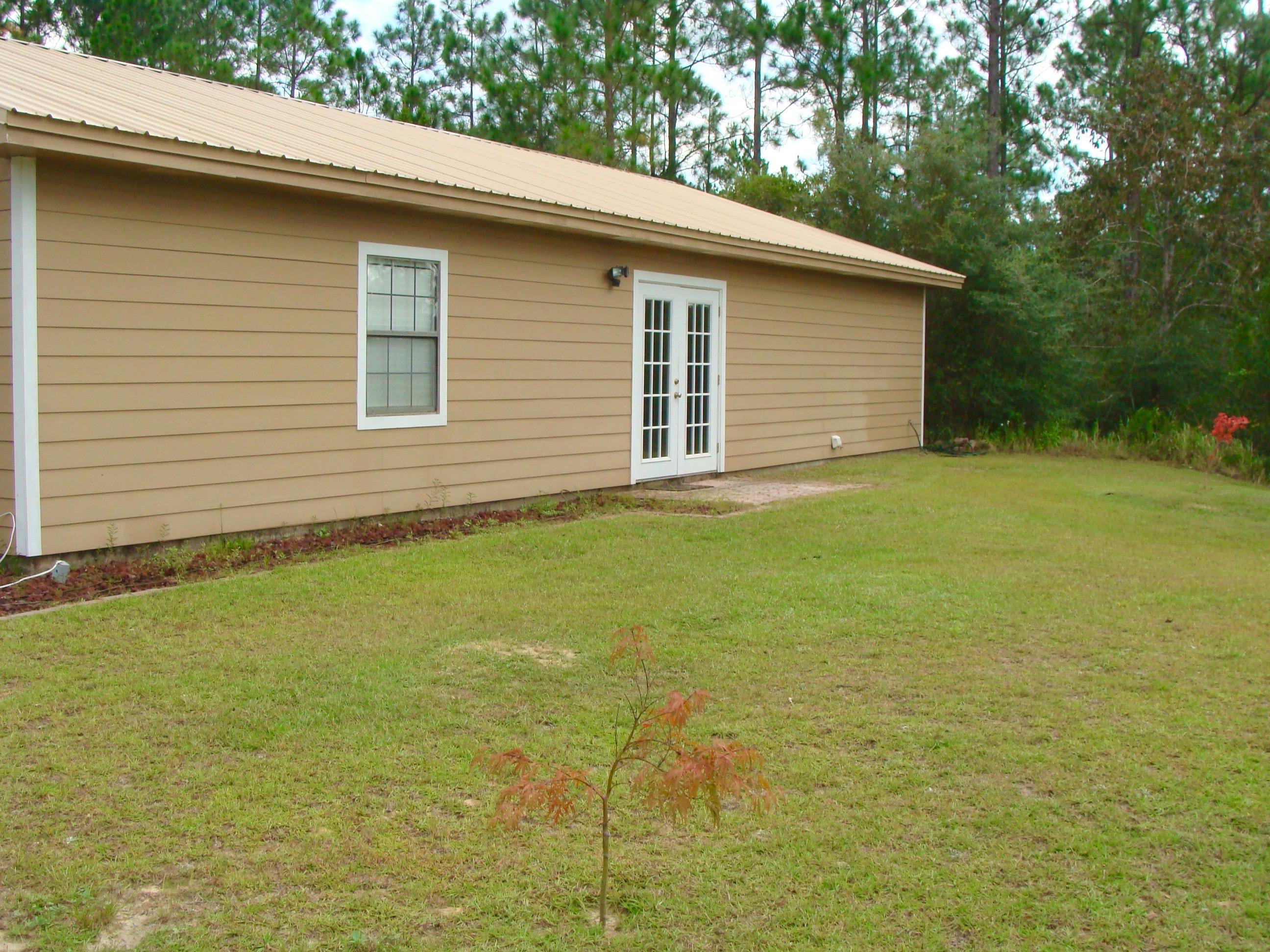 1122 Rock Hill Road DeFuniak Springs, FL 32435 - Photo 8 of 43 Back Yard