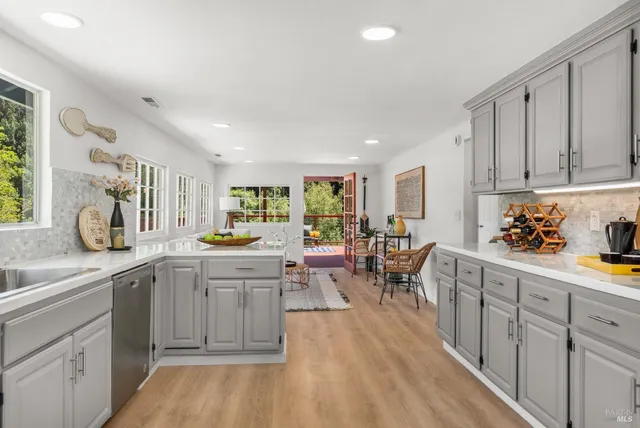 a kitchen with lots of counter top space and dining table