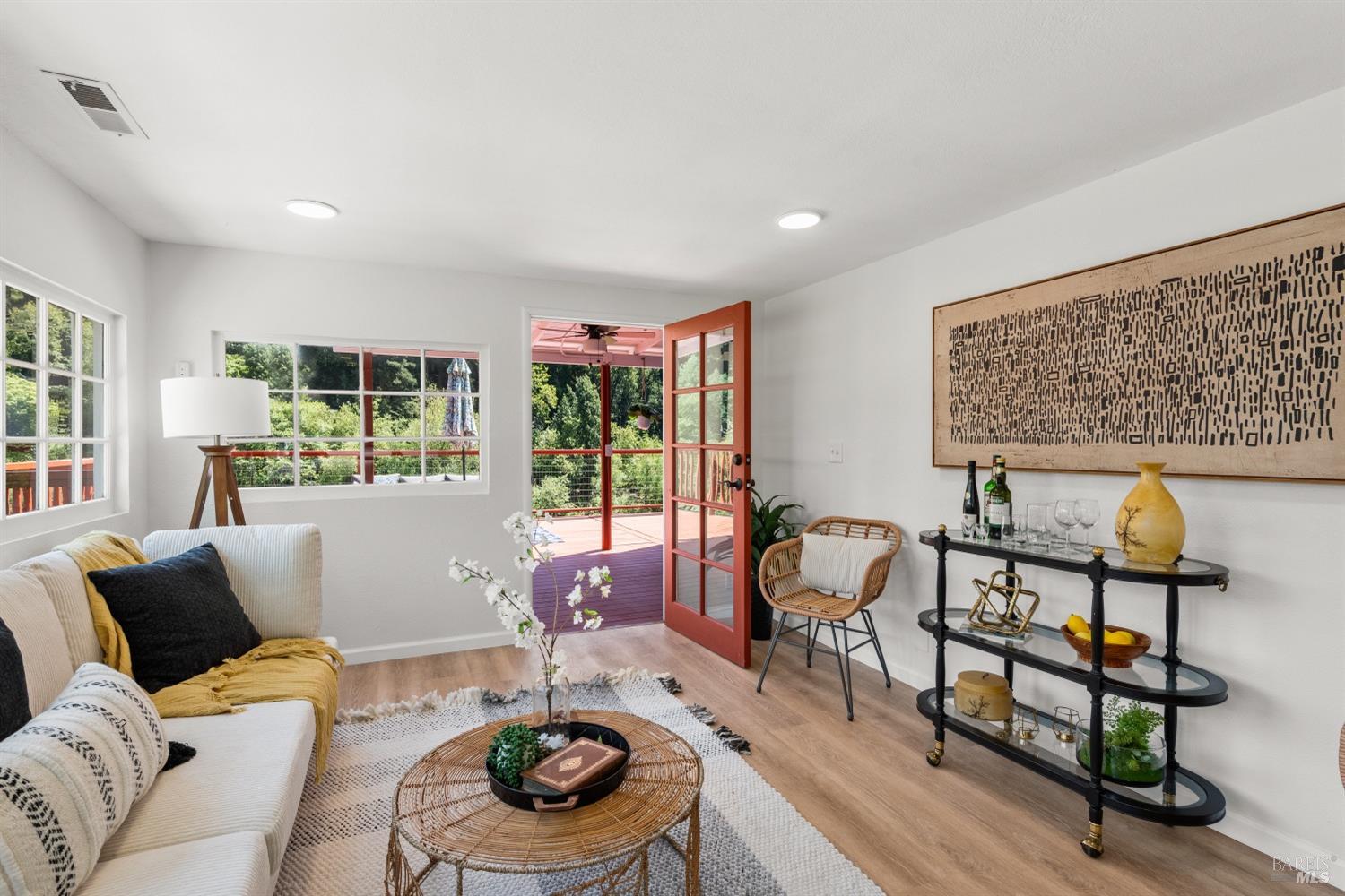 15627 Riverside Drive Guerneville, CA 95446 - Photo 20 of 41 a living room with furniture and wooden floor