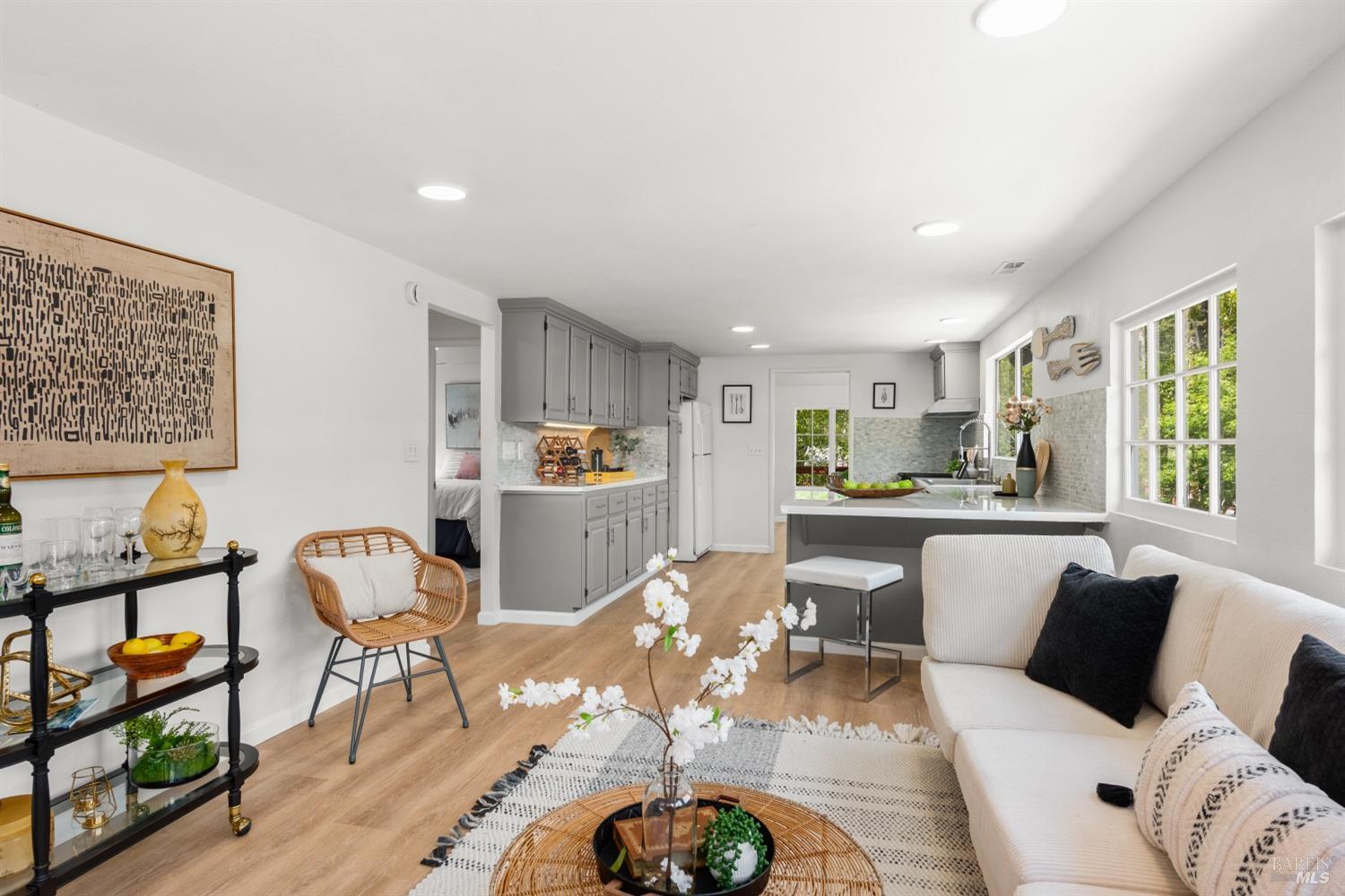 15627 Riverside Drive Guerneville, CA 95446 - Photo 24 of 41 a living room with furniture and a wooden floor