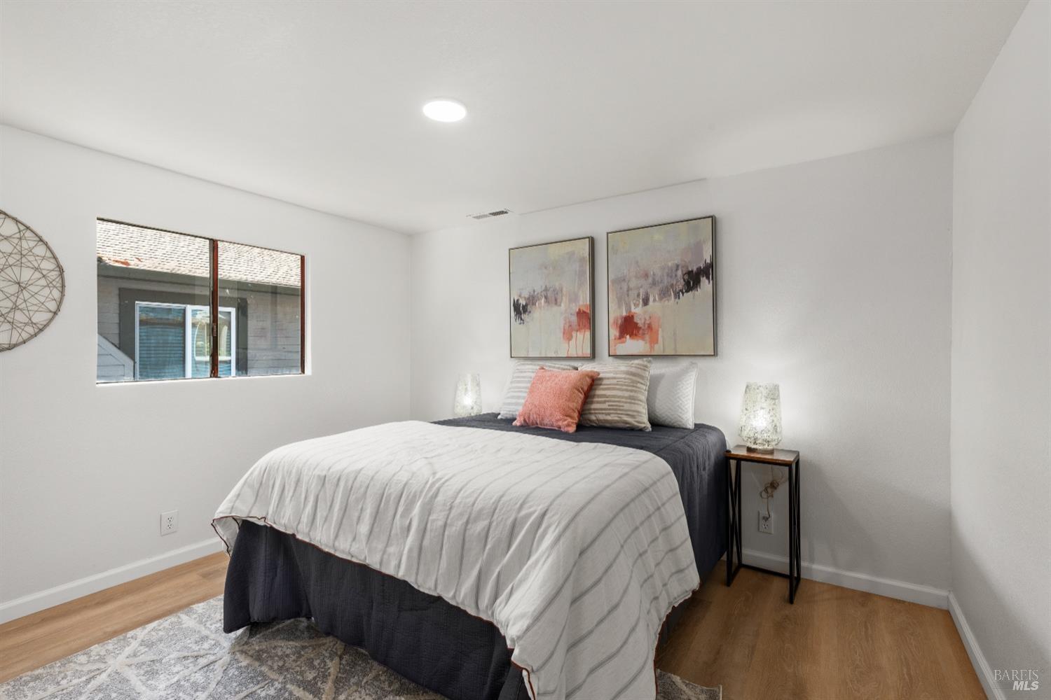 15627 Riverside Drive Guerneville, CA 95446 - Photo 25 of 41 a bedroom with a bed and a window