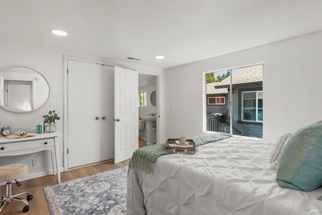 a bedroom with a bed and a window