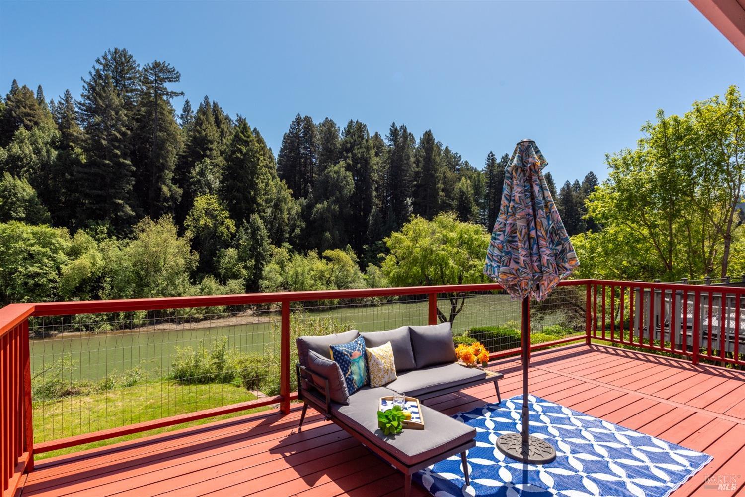 15627 Riverside Drive Guerneville, CA 95446 - Photo 3 of 41 a outdoor space with wooden floor and outdoor seating
