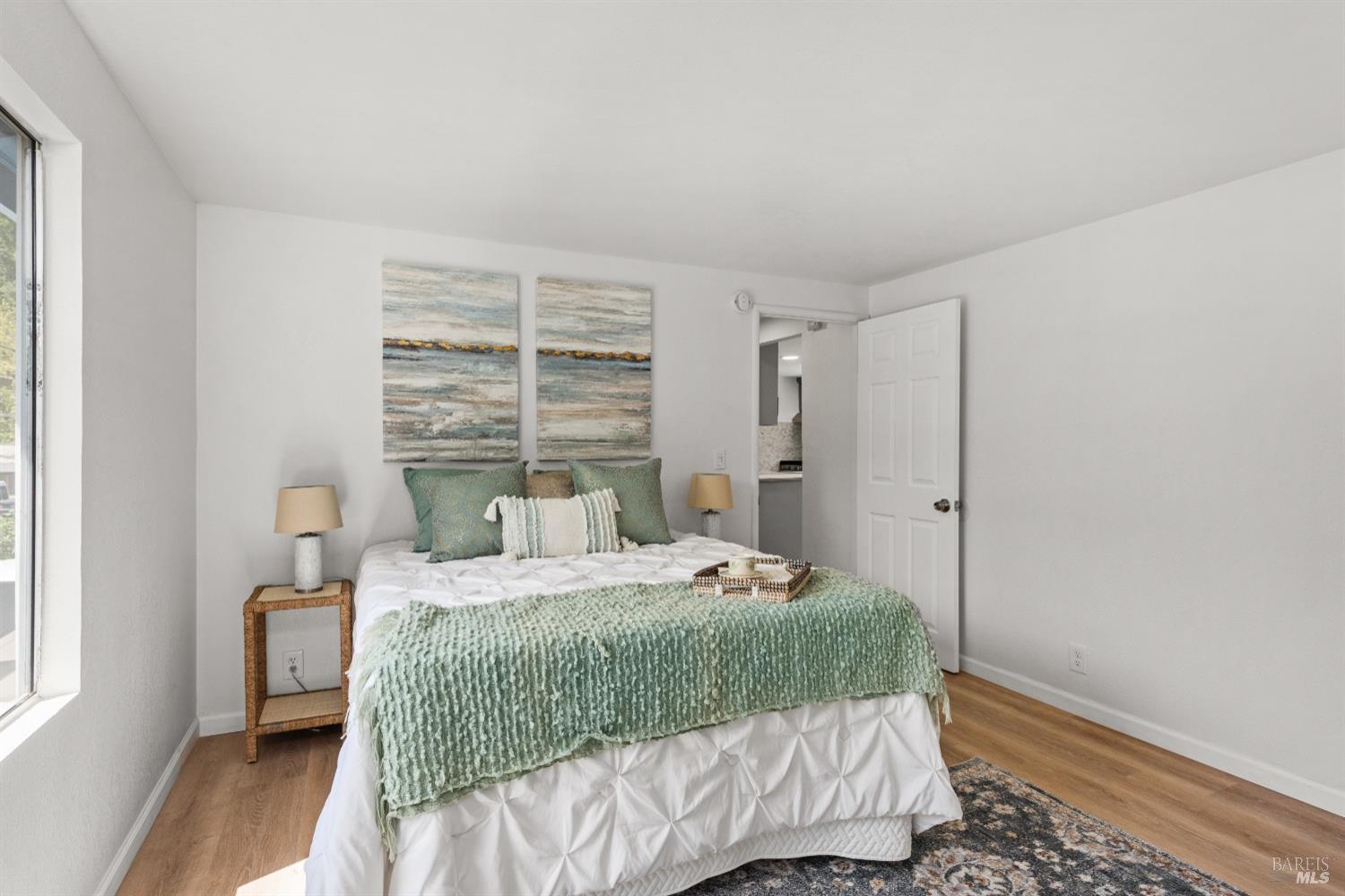 15627 Riverside Drive Guerneville, CA 95446 - Photo 31 of 41 a bedroom with a bed and a window