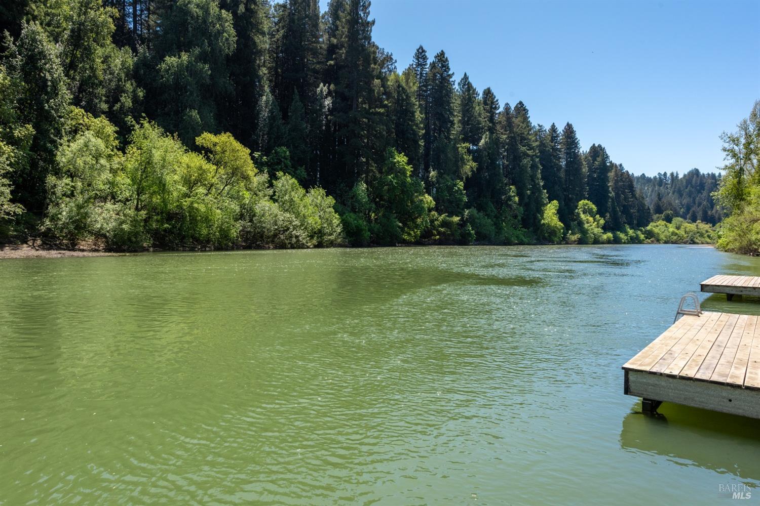 15627 Riverside Drive Guerneville, CA 95446 - Photo 35 of 41 a view of a swimming pool with a yard