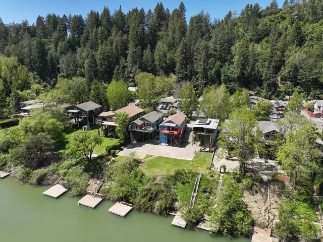an aerial view of a house with outdoor space and street view