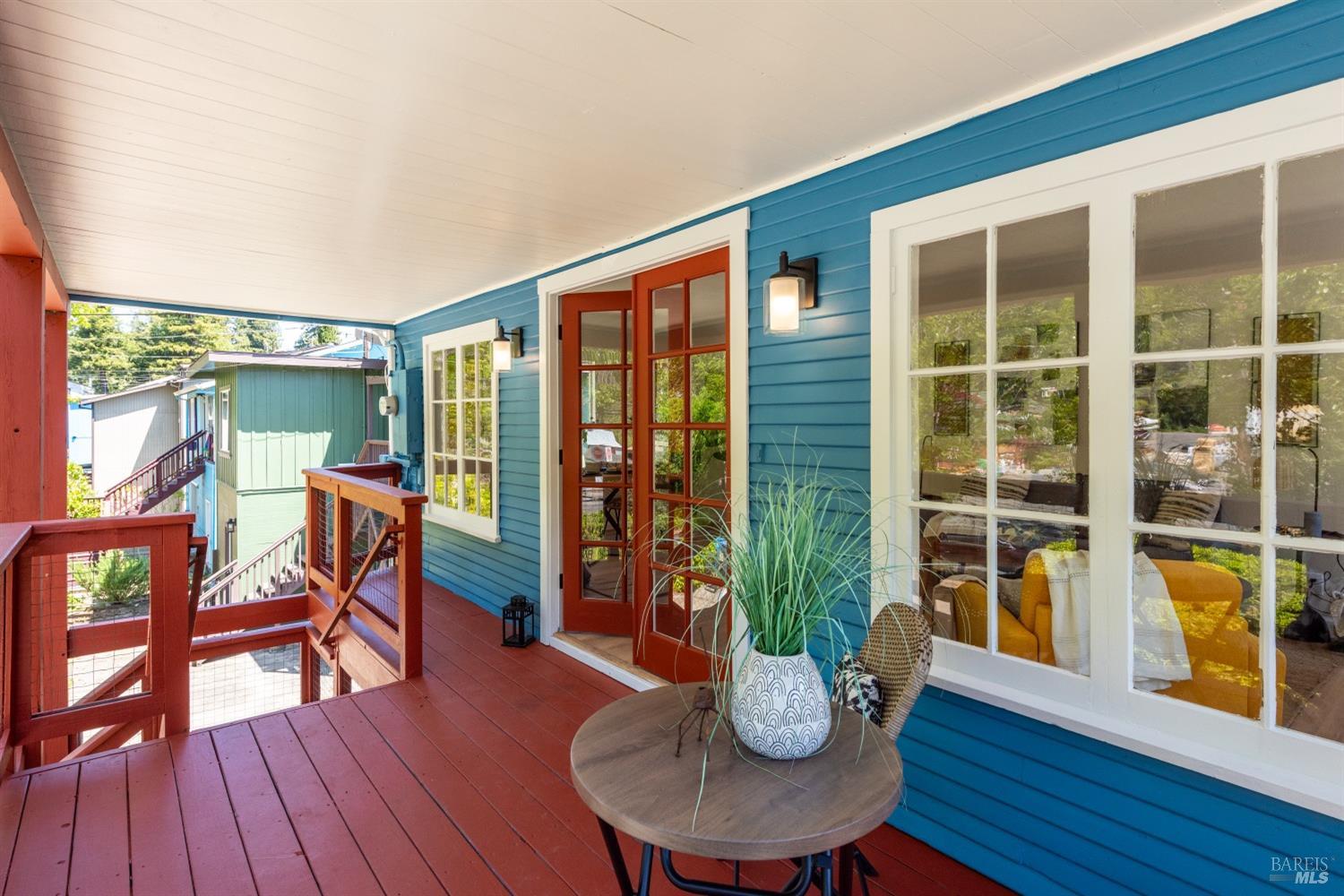 15627 Riverside Drive Guerneville, CA 95446 - Photo 6 of 41 a view of a dining room with furniture window and wooden floor