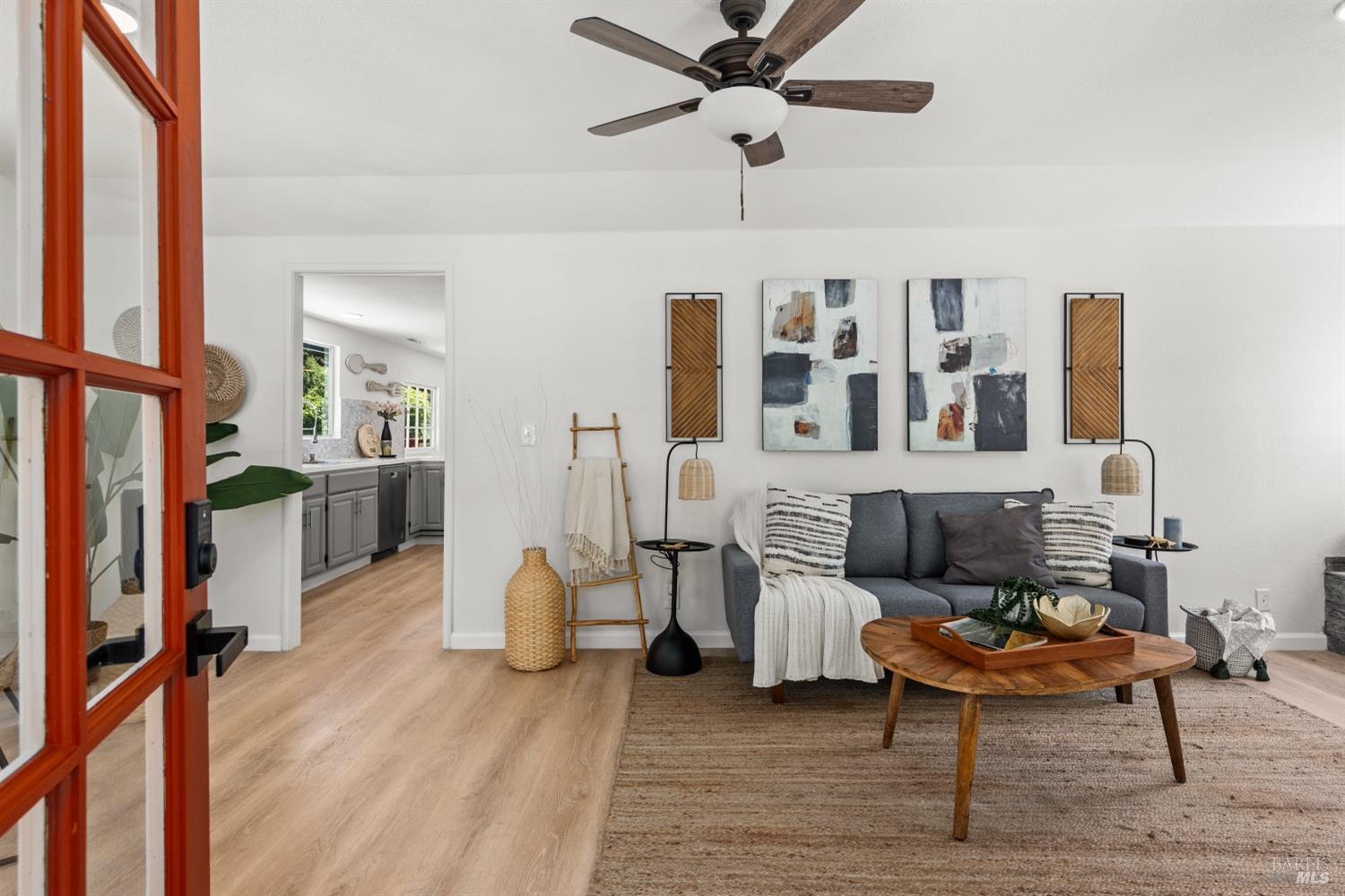 15627 Riverside Drive Guerneville, CA 95446 - Photo 9 of 41 a living room with furniture and a wooden floor