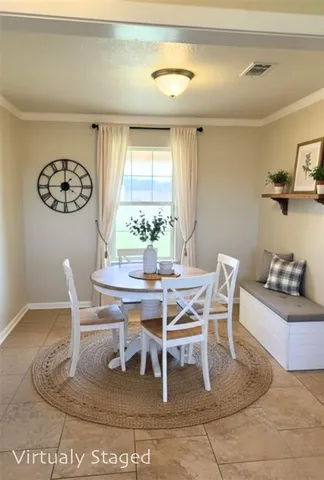 a dining room with a table and chair
