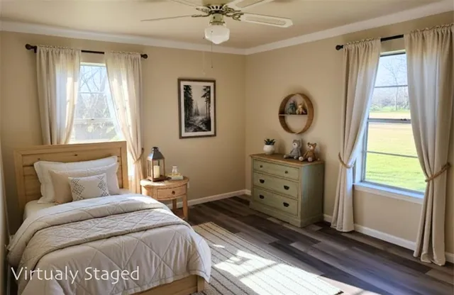 a bedroom with a large bed and a window