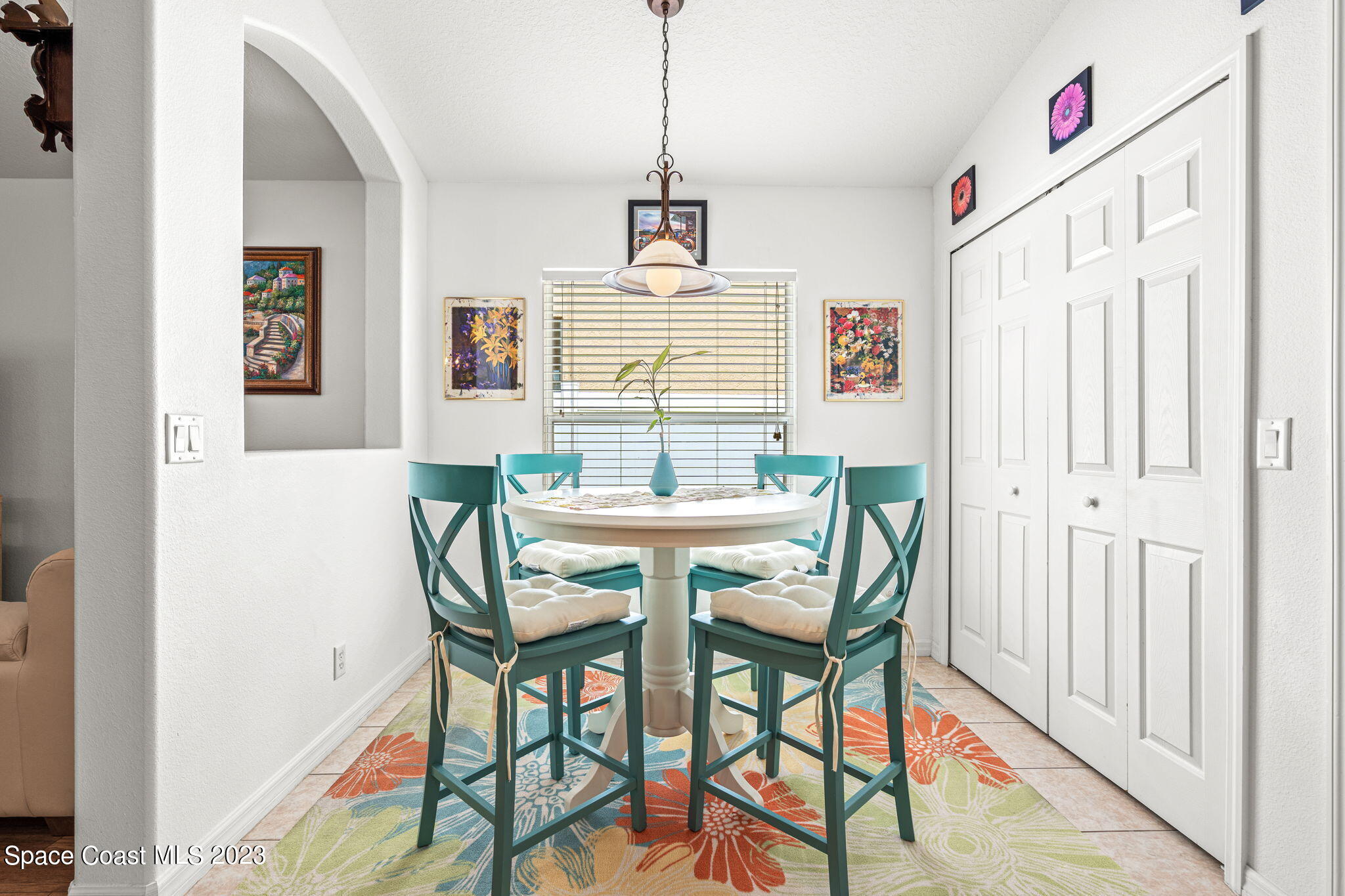 2463 Glasbern Circle Melbourne, FL 32904 - Photo 12 of 57 a dining room with furniture and window