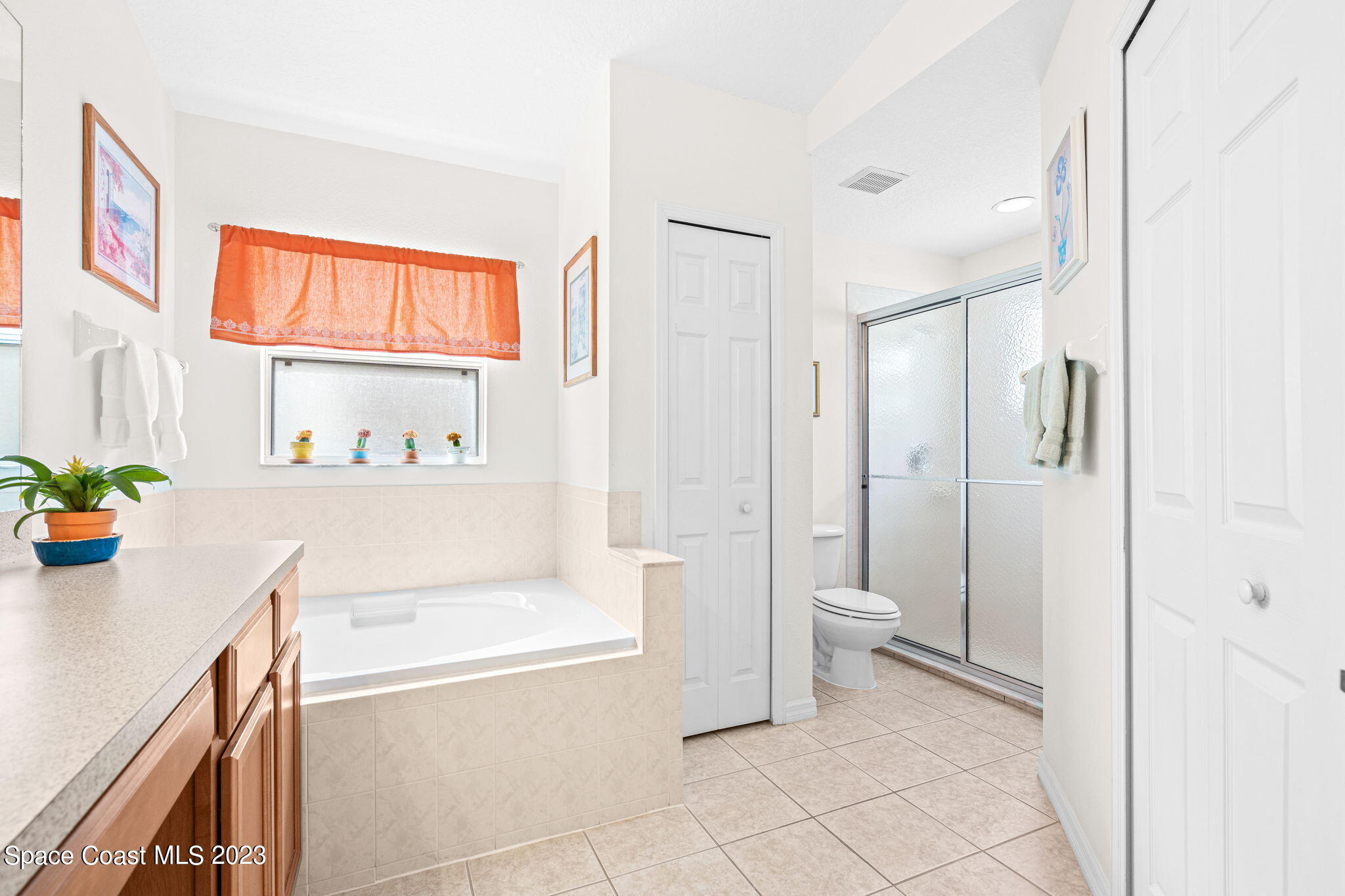 2463 Glasbern Circle Melbourne, FL 32904 - Photo 20 of 57 a bathroom with a sink a toilet and shower